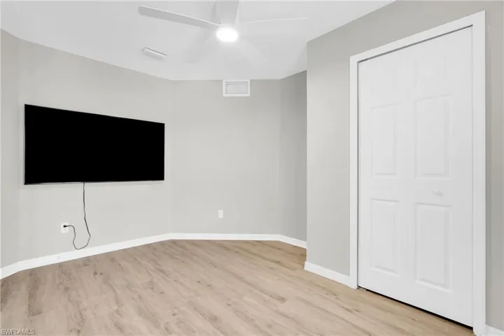 Unfurnished bedroom featuring light wood-type flooring and a ceiling fan