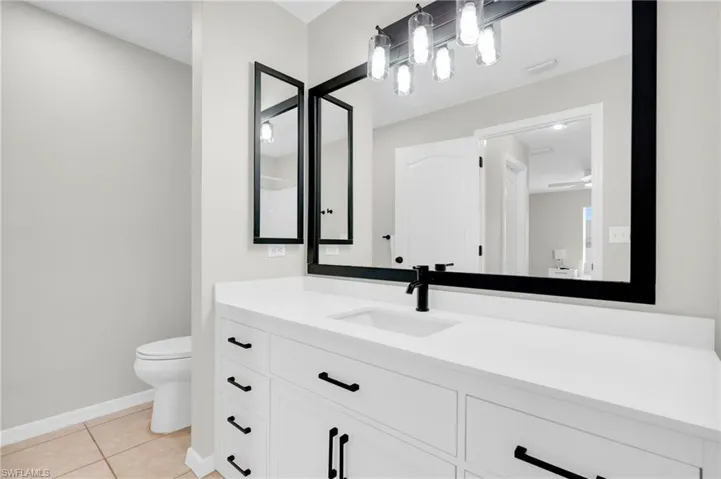 Bathroom featuring vanity and tile patterned flooring