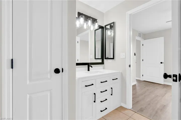 Bathroom featuring vanity and tile patterned flooring