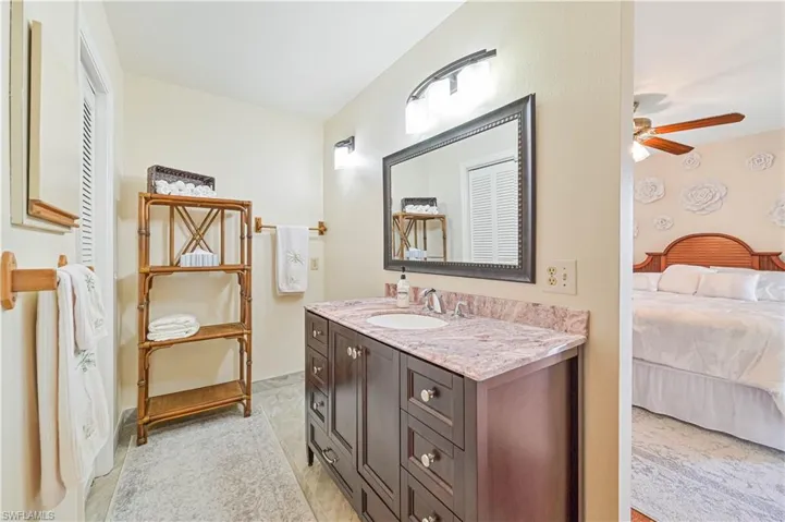 Bathroom featuring vanity and ceiling fan