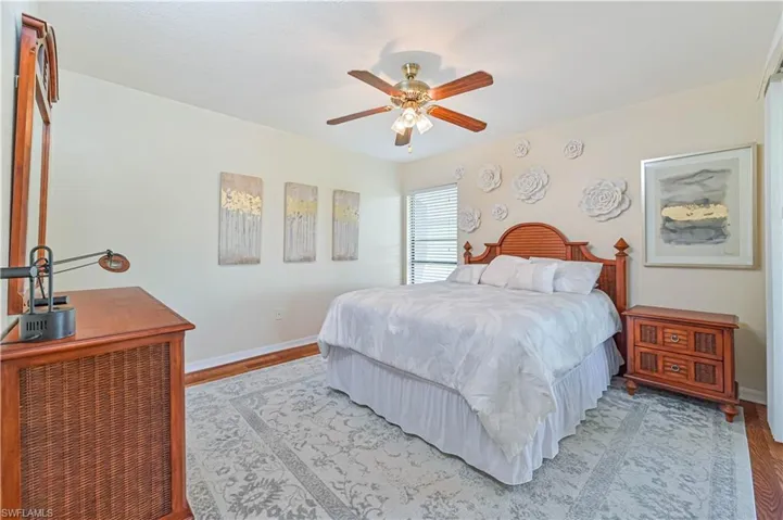Bedroom with light wood-type flooring and ceiling fan