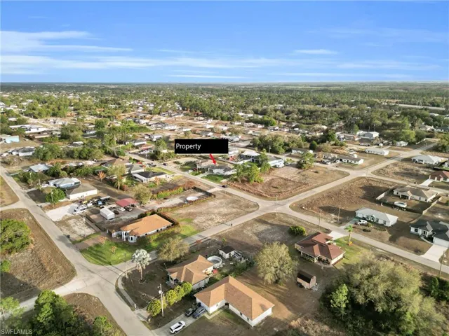 Aerial overview of property's location featuring nearby suburban area