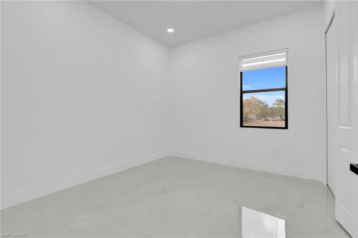 Guess Bedroom featuring recessed lighting and finished concrete floors