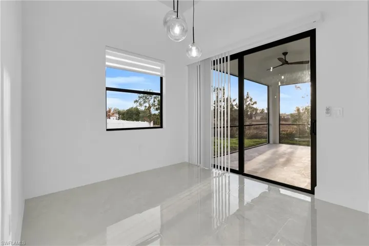 Unfurnished dining area featuring a ceiling fan and baseboards