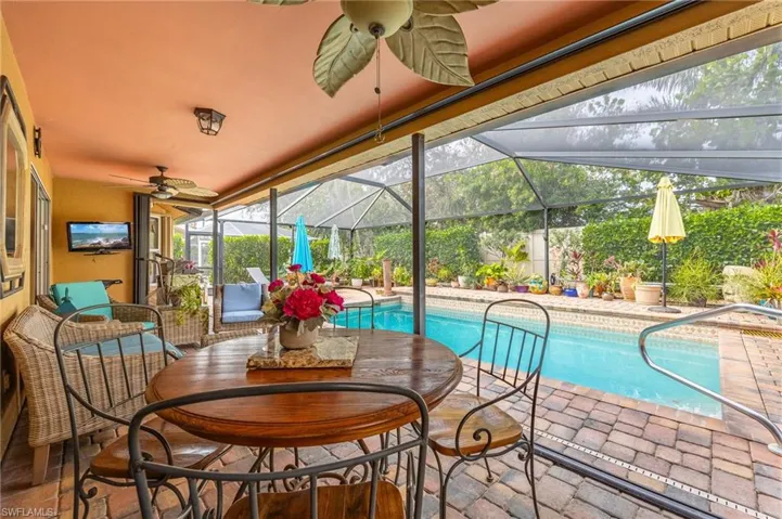 Pool with paver patio, under truss seating and extended paver deck