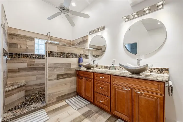 Modern updated Master bathroom with walk-in shower, rain faucet, dual vanities, handicap friendly layout