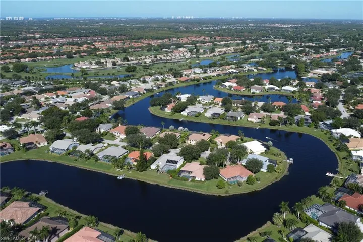 View of property location with a large body of water and nearby suburban area