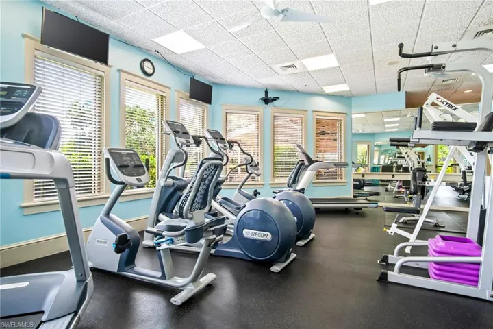 Gym with a paneled ceiling