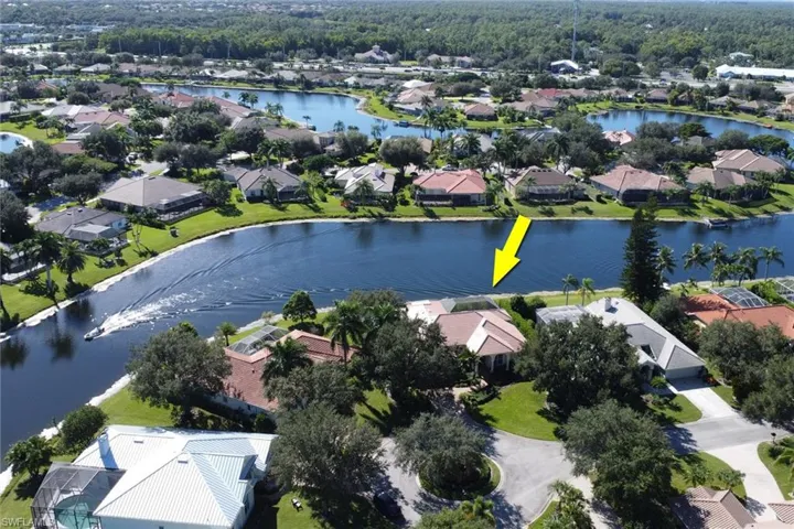 View of property location featuring nearby suburban area and a nearby body of water
