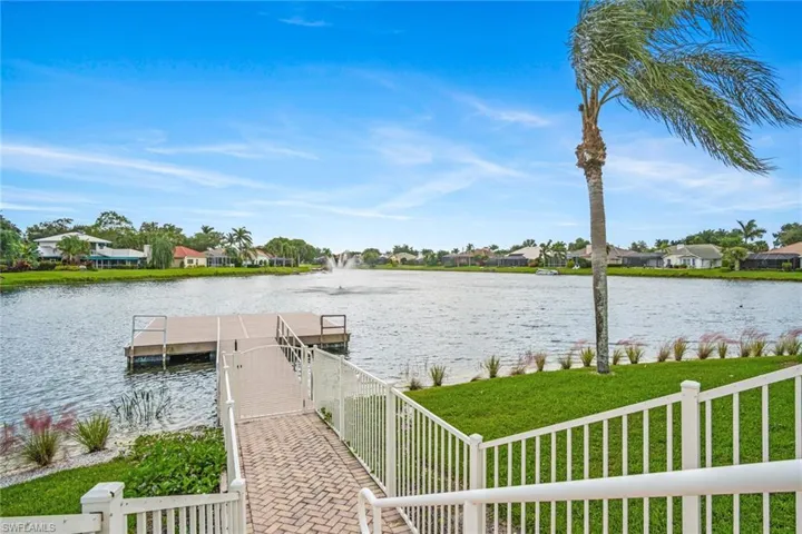 Dock featuring a residential view and a water view