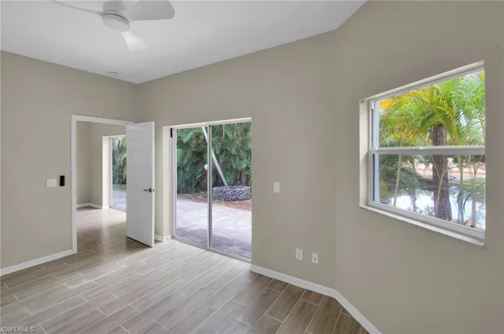 Unfurnished room with light hardwood / wood-style floors and ceiling fan