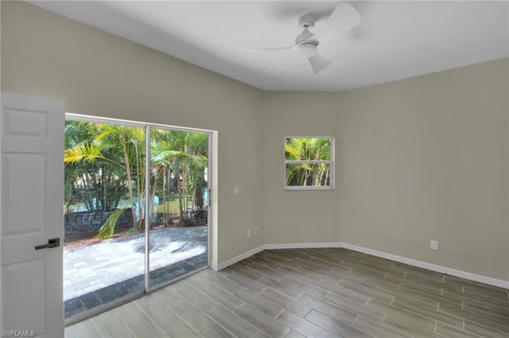 Spare room with ceiling fan and hardwood / wood-style floors