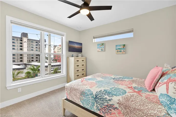 Bedroom with carpet and a ceiling fan - Virtually Edited Image