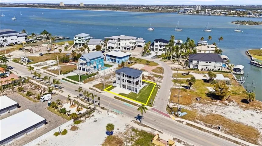Aerial perspective of suburban area featuring a large body of water - Virtually Edited Image