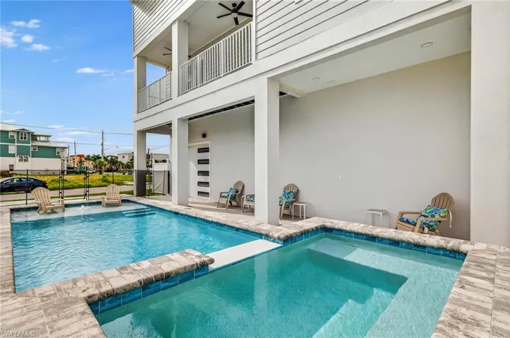 Integrated pool / hot tub with a patio and a balcony - Virtually Edited Image