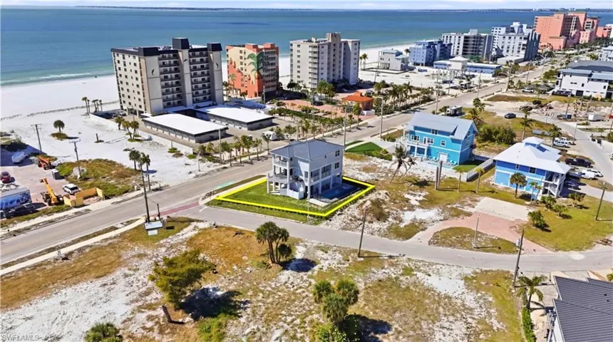 Aerial view of property and surrounding area with unending shoreline and property parcel outlined - Virtually Edited Image