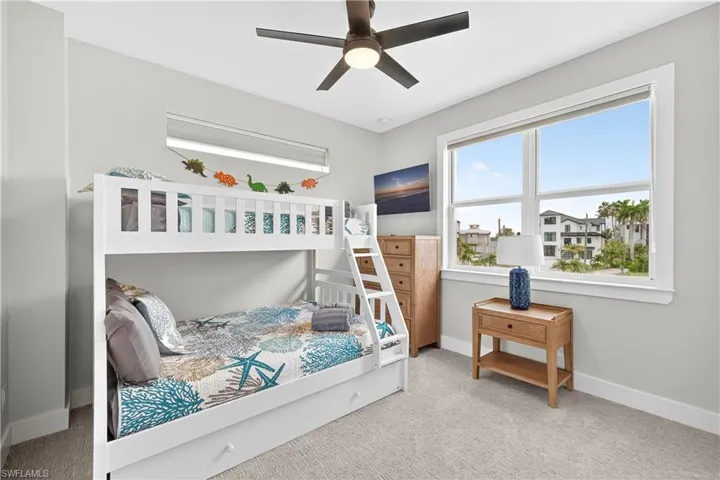 Bedroom with carpet flooring and a ceiling fan - Virtually Edited Image