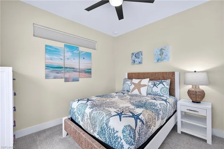 Bedroom featuring carpet and ceiling fan - Virtually Edited Image