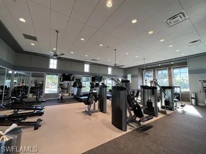Workout area with a ceiling fan, carpet, and recessed lighting
