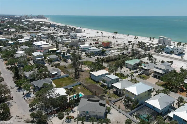 Aerial view with a view of the beach and a water view