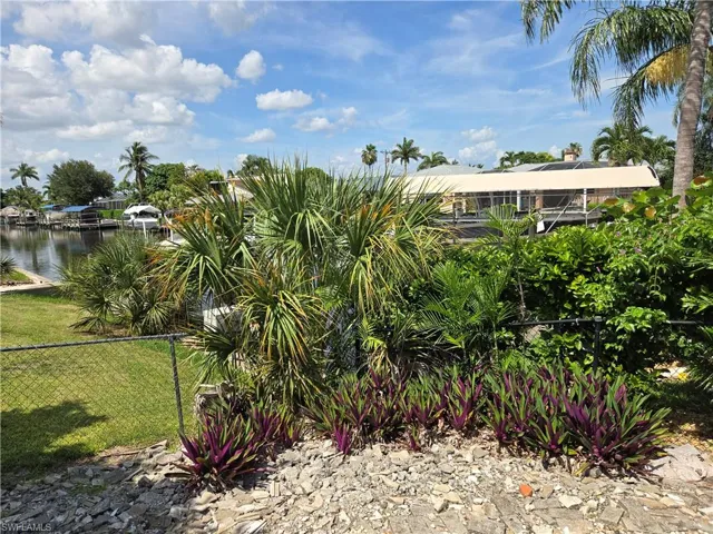 View of yard with a water view