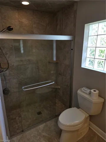 Full bath featuring a stall shower