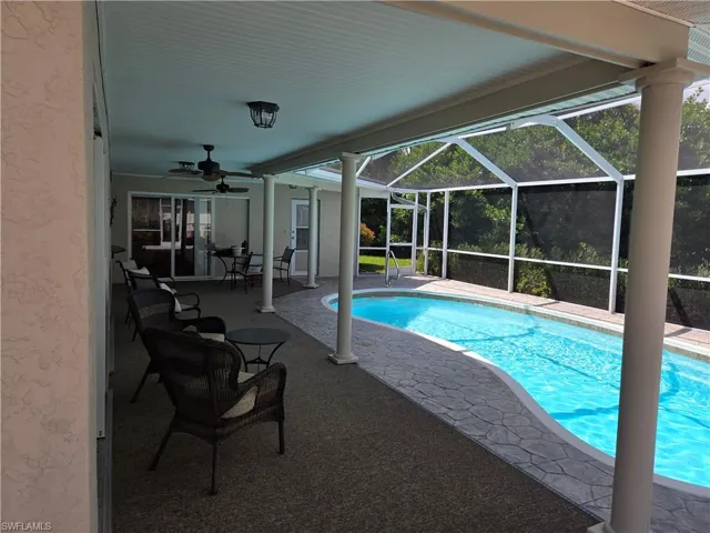 Outdoor pool with a 34X8 patio and a ceiling fan