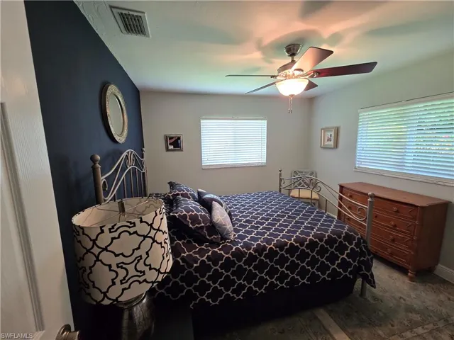 Bedroom 2 featuring ceiling fan and wood finished floors