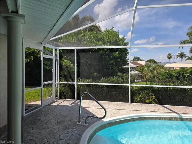 Outdoor pool featuring a lanai and a patio area