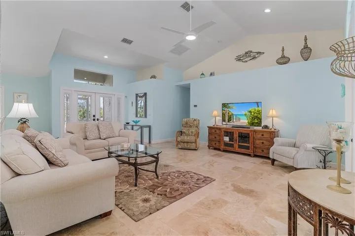 Open plan living room with access direct to pool