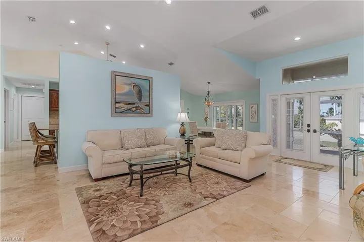 Home has Travertine tile throughout and on the courtyard.