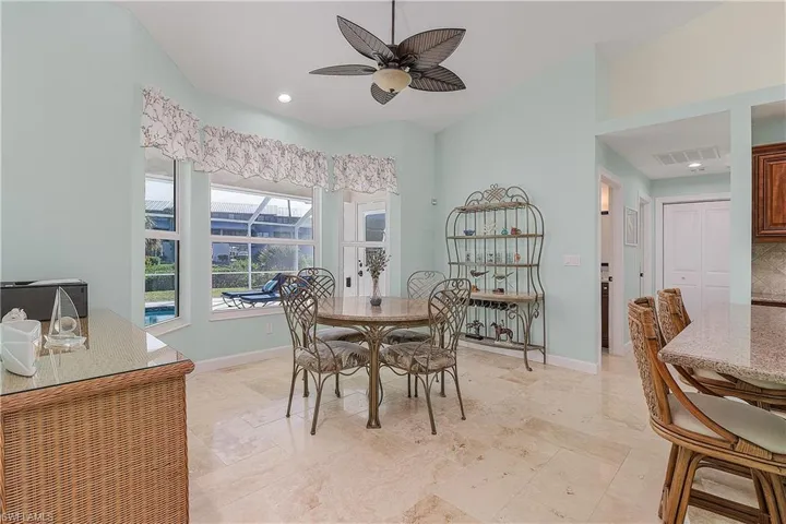 Dining area overlooking the pool area and patio