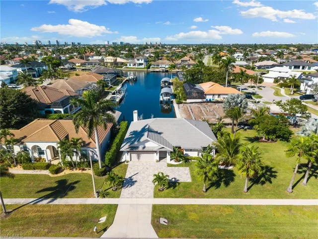 Aerial view of residential area with a nearby body of water