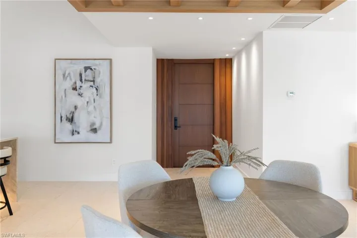Dining space with recessed lighting and baseboards