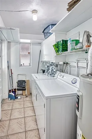 Washroom with electric water heater and washing machine and dryer