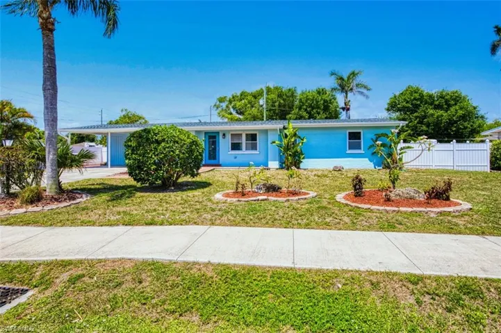 Ranch-style home with an attached carport