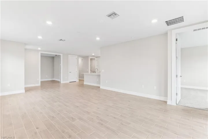 Unfurnished living room featuring recessed lighting and light wood-style floors