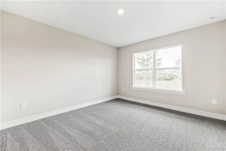 Spare room with carpet floors and recessed lighting