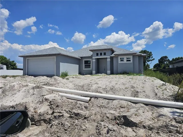 Prairie-style home with a garage