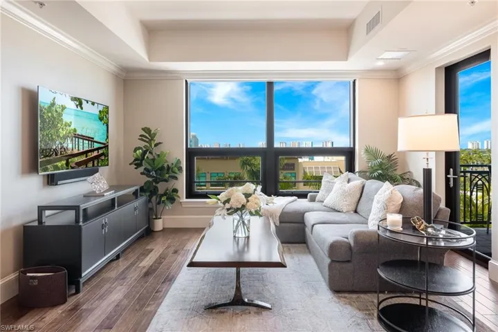 Living area with Lots of natural light & wood finished floors
