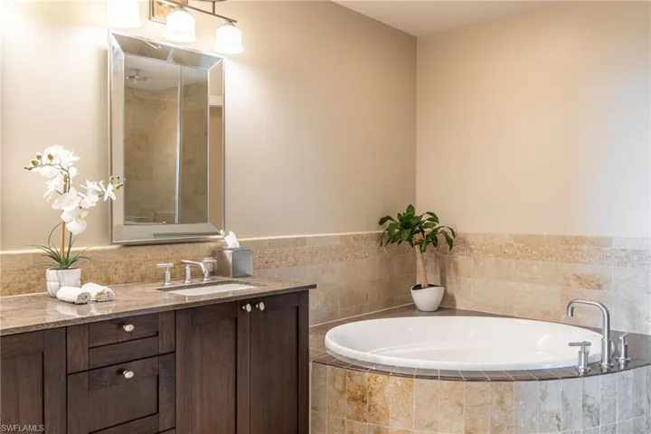 Full bathroom featuring a bath and vanity