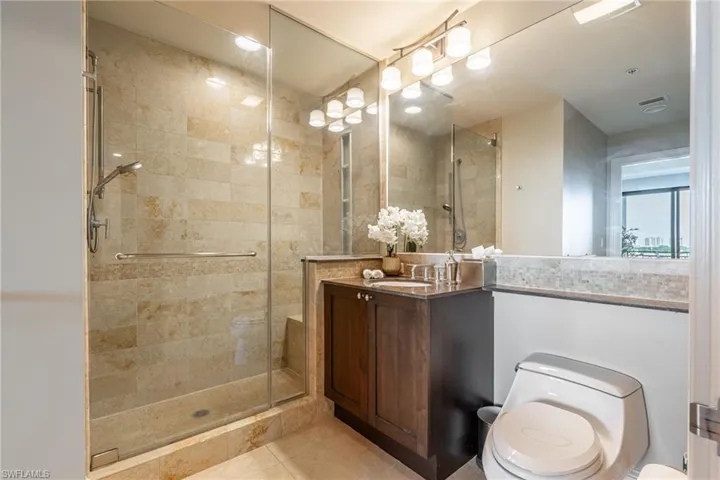 Full bathroom featuring a shower stall, vanity, tile patterned floors, and recessed lighting