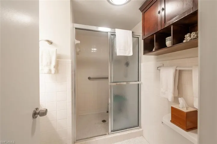 Walkin shower in guest bathroom and more nice storage.