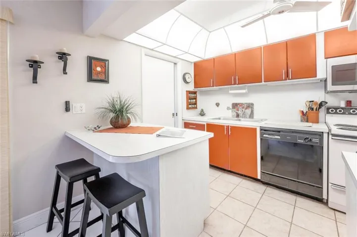Kitchen and door to left enters into laundry/utility room.