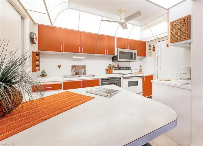 Wonderfully efficient galley kitchen with walkin pantry door to the right.