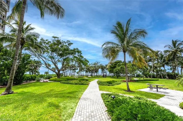 OPTIONAL MEMBERSHIP PARK ON GULF OF MEXICO--WITH BENCHES, TABLES, PATHS THROUGH GARDENS.