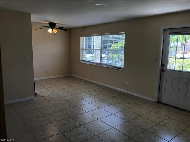 Entry featuring tile floors