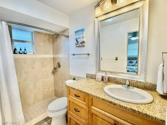 Ensuite bathroom with vanity and a shower stall