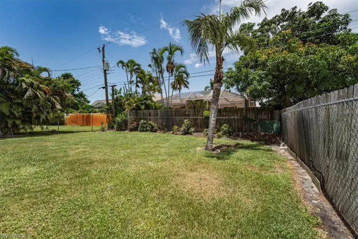 View of fenced backyard