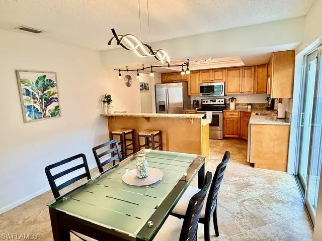 Dining space featuring a textured ceiling
